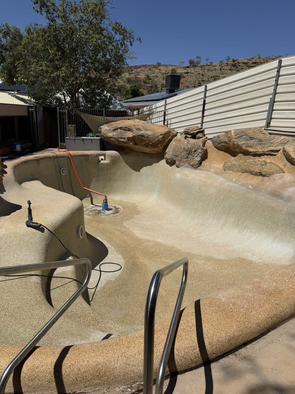 Pool being drained during the acid wash process