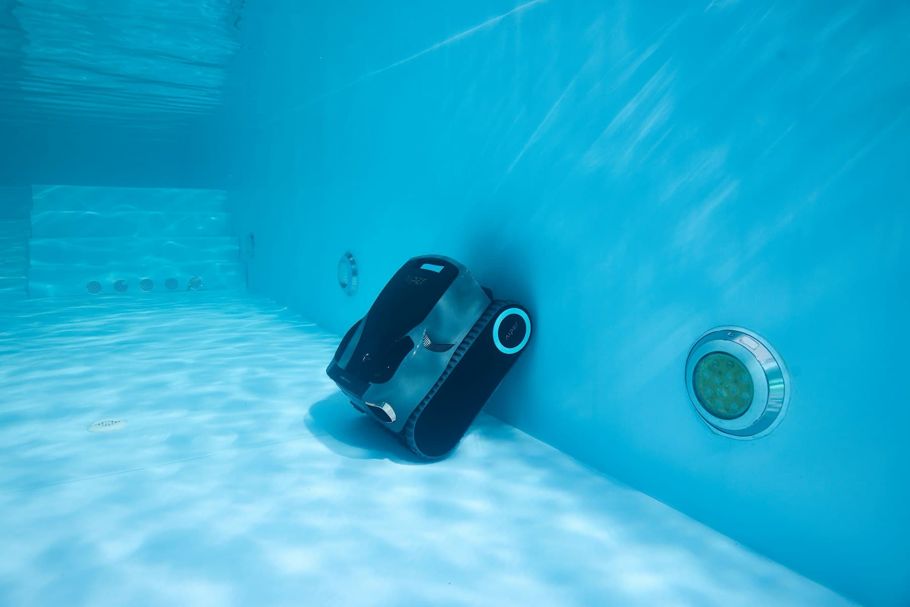 Underwater pool lighting and robotic pool cleaner